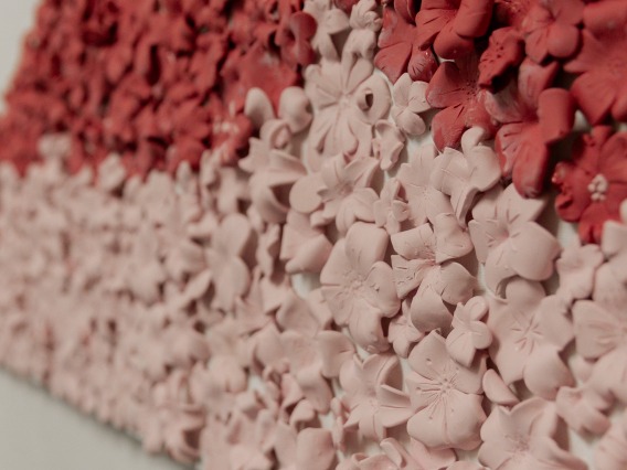 clay flowers on canvas zoomed in