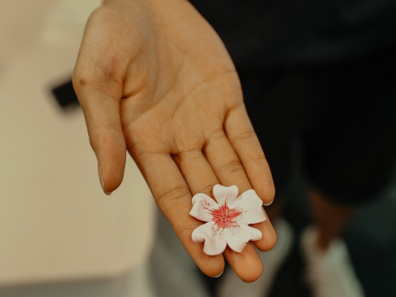 clay flower on hand